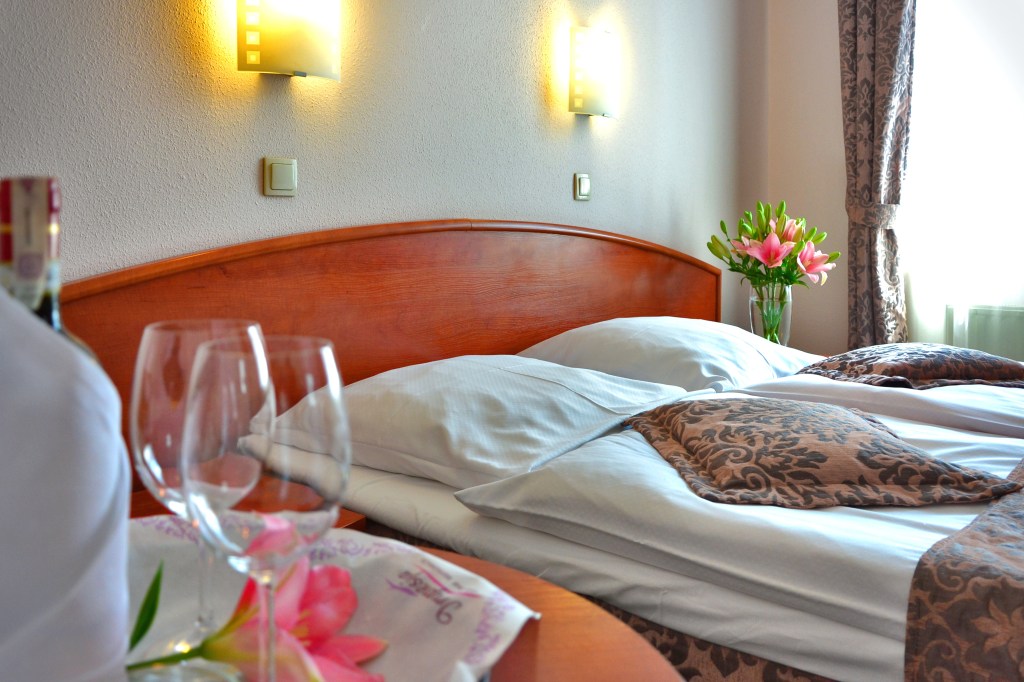 Travel booking comparison including hotel rates fees cancellation terms and member benefits